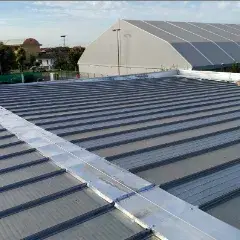 Snow-melting film under corrugated metal sheet roofs